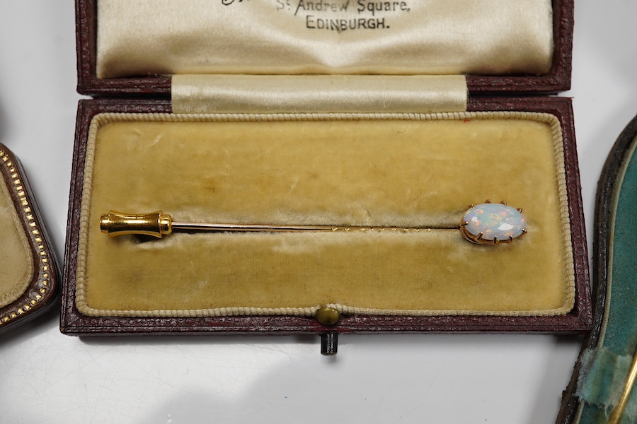 A group of gentleman's accessories, early 20th century, comprising: two pairs of cultured pearl collar studs, one set marked 15CT, each with fitted cases; a stick pin topped with the head of a fox, indistinct mark to pin